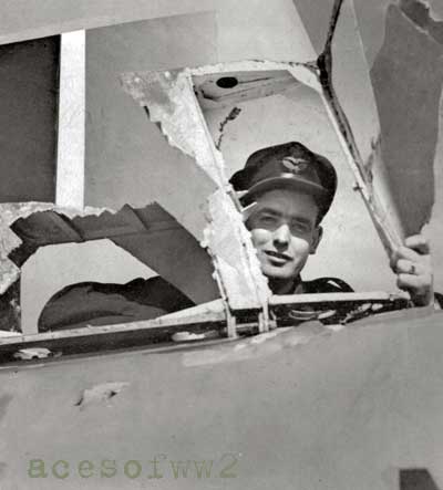 Johnny Caine looks through the flak-damaged tail of his 406 Sq. Mossie