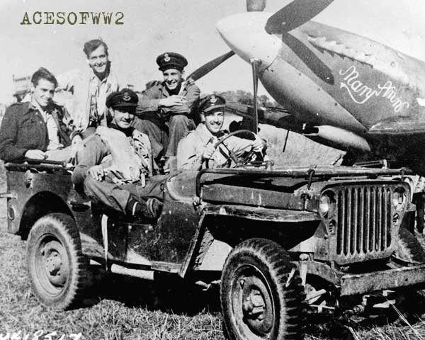 Above are shown some of the pilots of an RAF Spitfire squadron now operating from Akyab aerodrome, on which they landed soon after Akyab's occupation by British forces.  They went into action against a force of Jap planes believe to number six, which attacked the airfield soon after the British entered.  Five of the enemy aircraft were destroyed.  The smiling faces of the lads above indicate their happiness at their one-sided victory.  At the wheel of the jeep is Squadron Leader R.W.R. (Bob) Day, of VANCOUVER, B.C. who shot down two of the attacking Japs. Beside him is Flight Lieutenant Clyde Simpson, of DEVONPORT AUCKLAND' NEW ZEALAND (5 Owens Rd.) who also bagged two planes.  Seated behind are Warrant Officer G.W. Wilson, of WHETSTONE, LONDON, England, Flight Sergeant, R.E. Owen, LIVERPOOL, England, and Pilot Officer Leonard Brett, WANTSTEAD, LONDON.