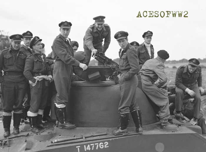 Sept. 1943. Andy MacKenzie (L front) & pilots of 403 Sq. investigate a Sherman tank. That's Hugh Godefroy in R front position & Hart Finley behind him in the turtleneck.