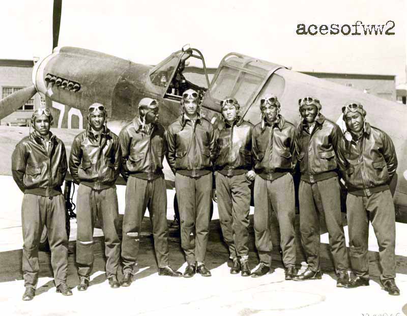 Tuskegee Airmen with a P-40